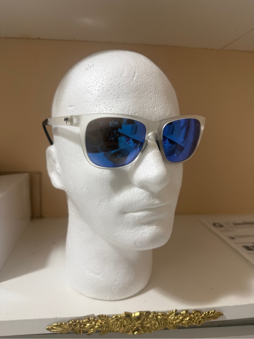 Polarized sunglasses, Maui Jim, translucent grey frame with blue mirror lenses